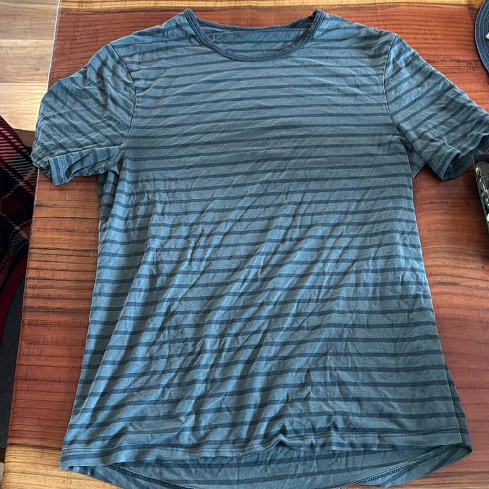 Lululemon dark blue striped fundamental t-shirt.